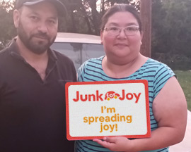 Donor holding JunkForJoy sign